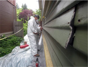 Shiplap siding removal during home energy retrofit by Portland & Seattle remodeler Hammer & Hand.