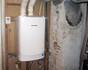 Tankless hot water heater in home performance retrofit.