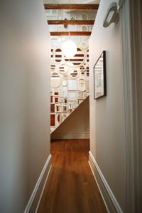 Hallway to Mirror Gallery Wall and Stairs in 936 Home Remodel