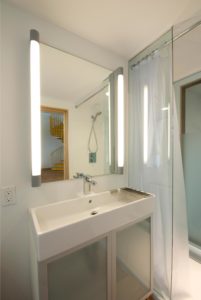 Bathroom Sink and Mirror in Musicians New Home