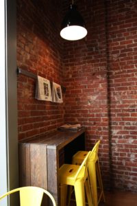 Seating Area and Brick Walls at Nuvrei Patisserie