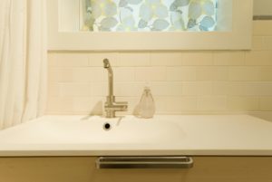 Sink and Backsplash Tile in Twin Studios Duplex Conversion