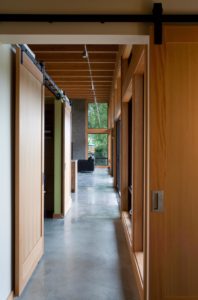 Hallway with Sliding Barn Doors in NW Modern Home