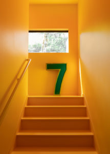 modern yellow basement staircase