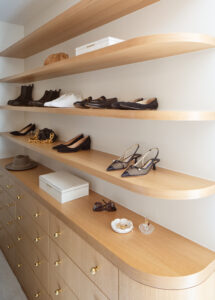 Custom closet cabinets with gold pulls